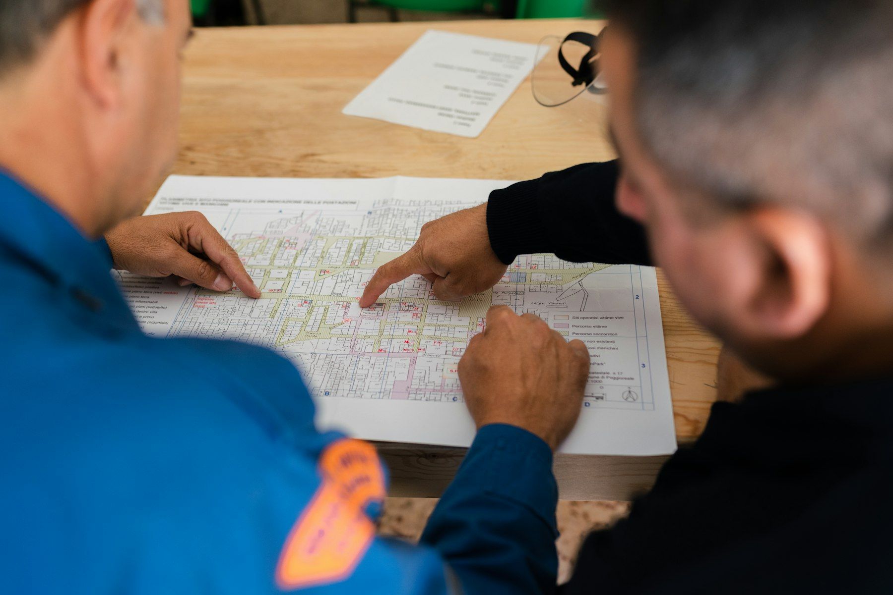 Facility owner and engineer reviewing drawings together