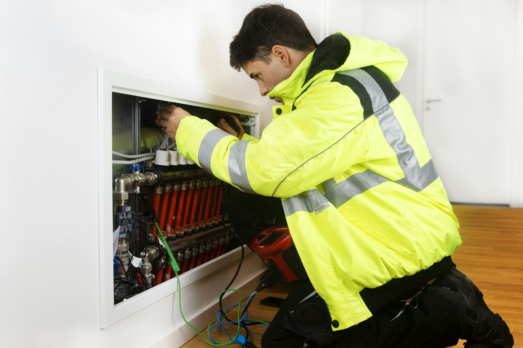 Integrator technician wiring a control panel